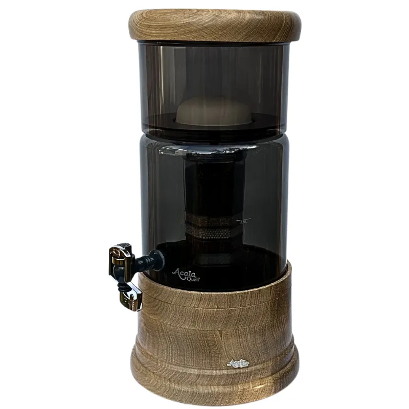 Antrazitfarbener AcalaQuell Mini mit Glastank und rund gearbeiteter Variante aus Eiche-Echtholz für Deckel und Sockel.