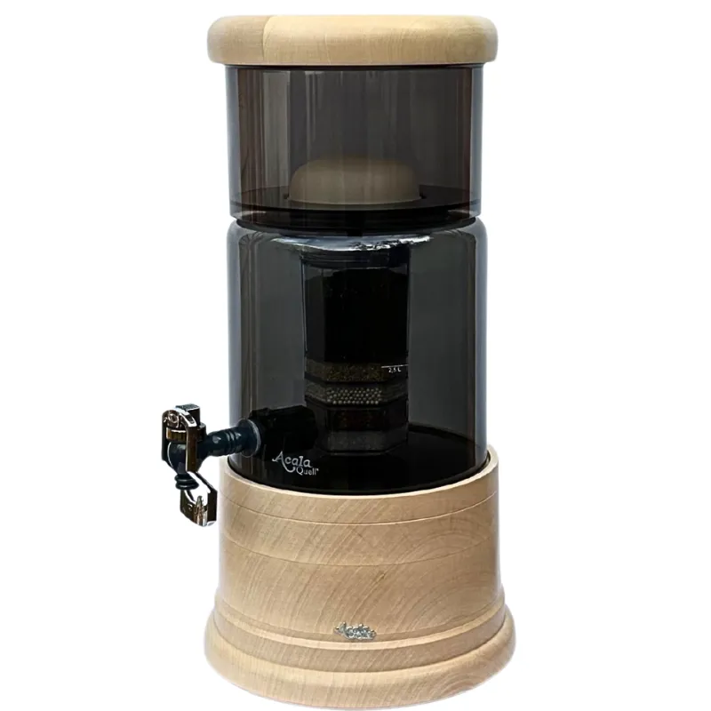 Antrazitfarbener AcalaQuell Mini mit Glasbehälter in Antrazit und rundem Deckel und Sockel aus massivem Ahornholz.